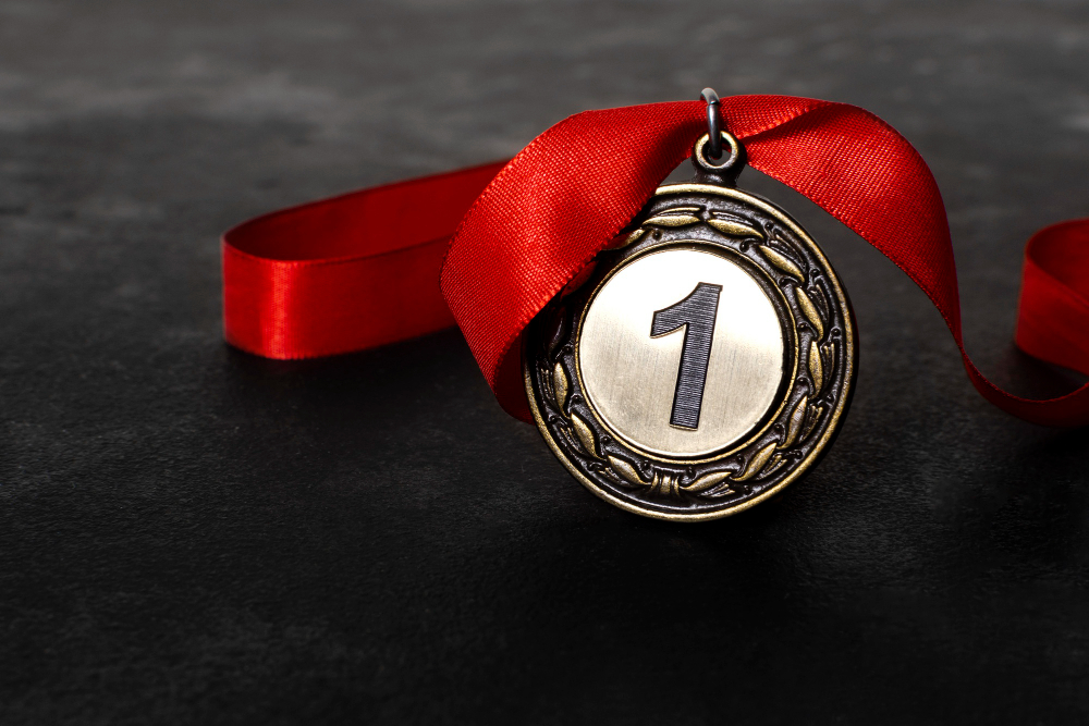 Close-up of a 2025 custom medal with modern engraved detailing