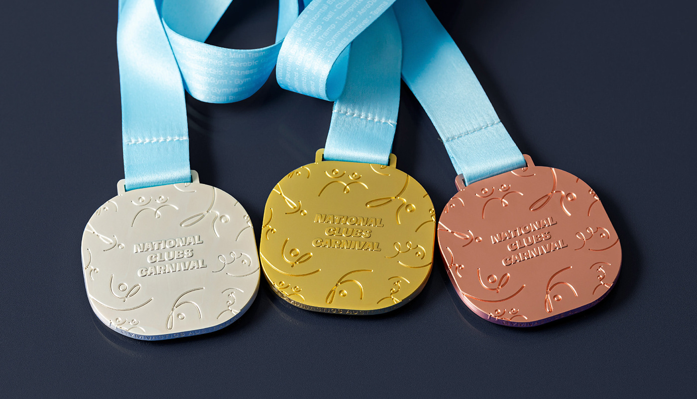 Modern gold medals with creative ribbon designs showcasing the evolution of traditional and contemporary medal styles.